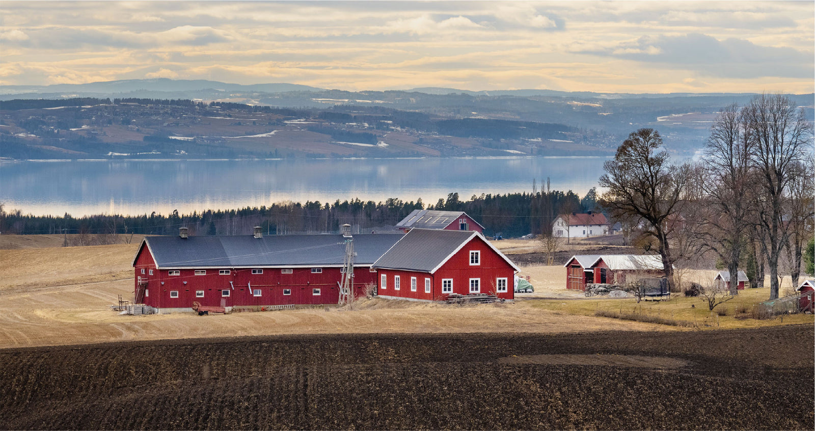 Norwegian landscape with barn in the foreground