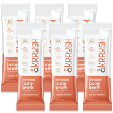 Packaging of ÅKrrush Savory Chicken Bone Broth with a white and peach color scheme, indicating 13g of hydrolyzed protein per serving, and listing ingredients such as Norwegian bone broth, chicken, onion, sage, tarragon, and turmeric.